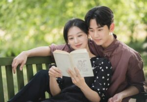 Couple reading book together.