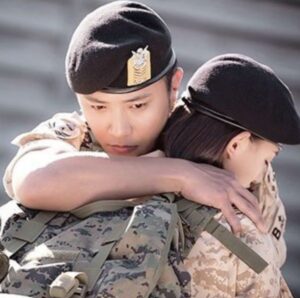 Soldiers embracing emotionally.