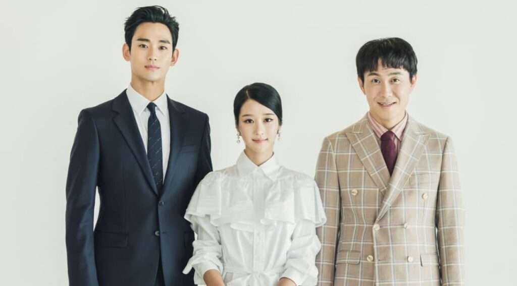 Three people posing formally together