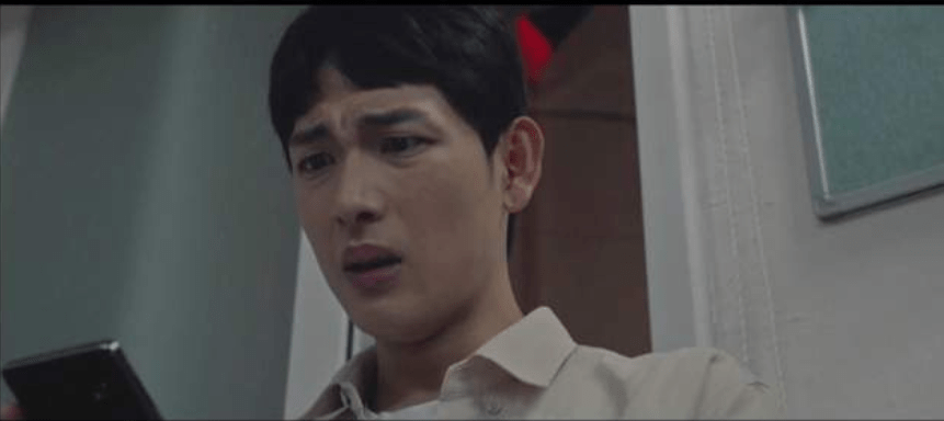 Man looking confused at phone. 