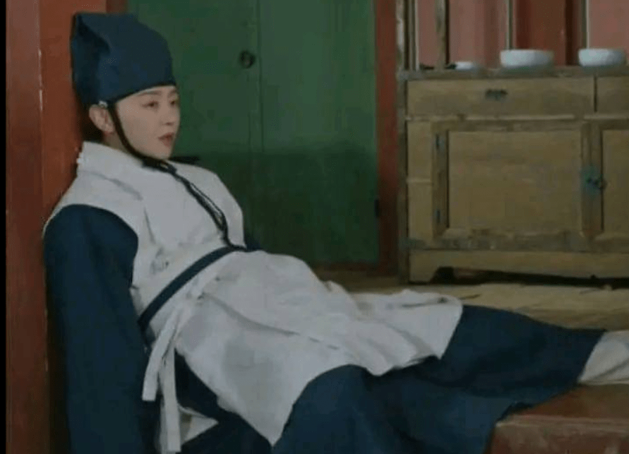 Wounded warrior slumped against wall.