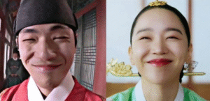 Smiling couple in traditional attire.
