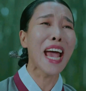 Woman screaming in emotional distress.
