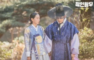 Royal couple in traditional attire.
