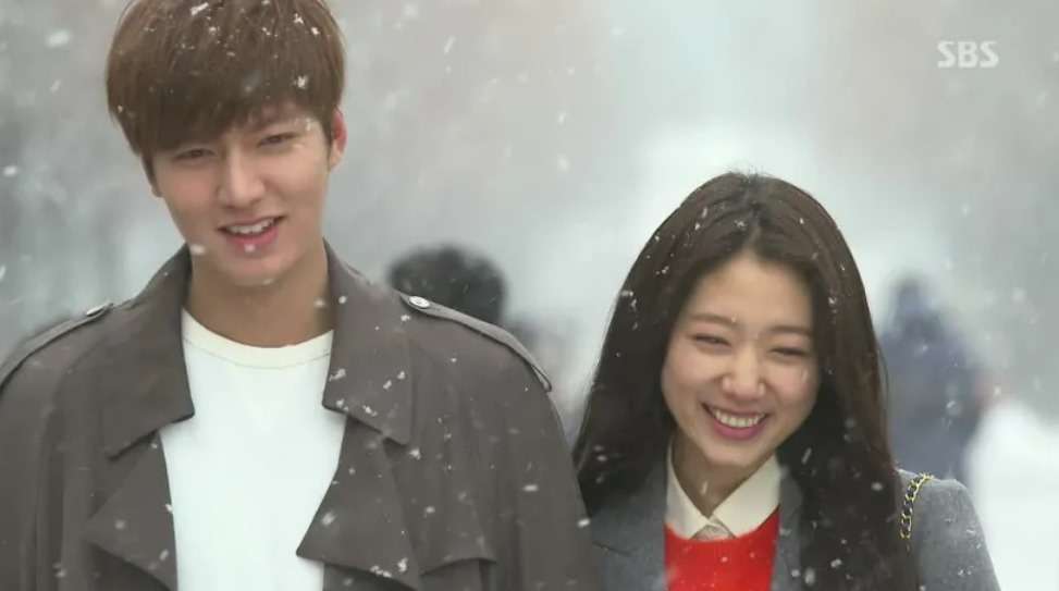 Smiling couple in snow. 
