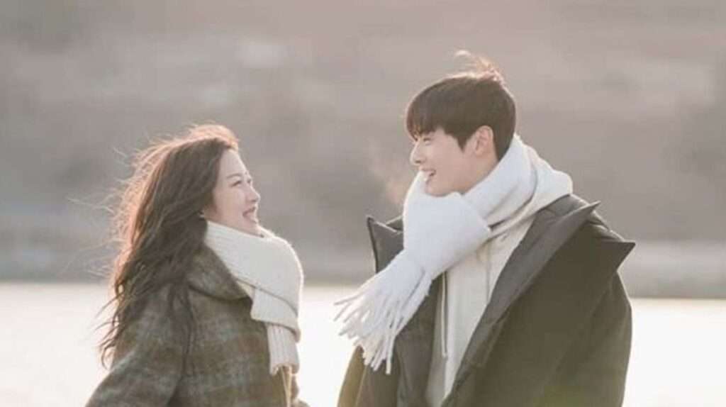 Smiling couple in winter coats.