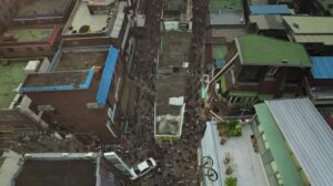 Crowded street filled with chaos. 