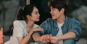 Couple sharing romantic gaze outdoors.
