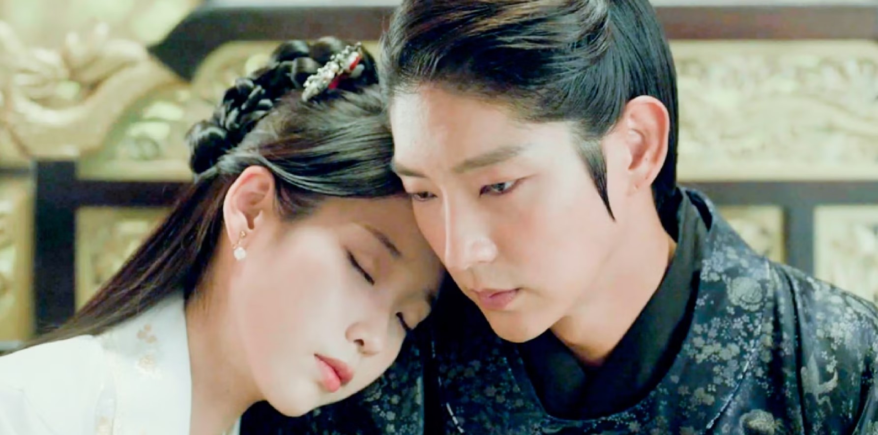 Moon Lovers: Scarlet Heart Ryeo intimate moment between IU and Lee Joon-Gi, as IU rests her head on Lee Joon-Gi's shoulder, showcasing their deep emotional bond and the quiet intensity of their royal love story