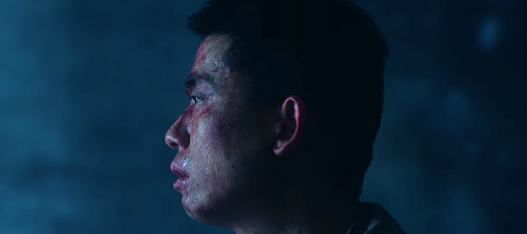Close-up of a soldier from DP Season 1, showing a side profile with visible bruises and sweat, highlighting the emotional and physical toll of his experience. The intense and gritty atmosphere reflects the struggles faced by the characters in DP Season 1.