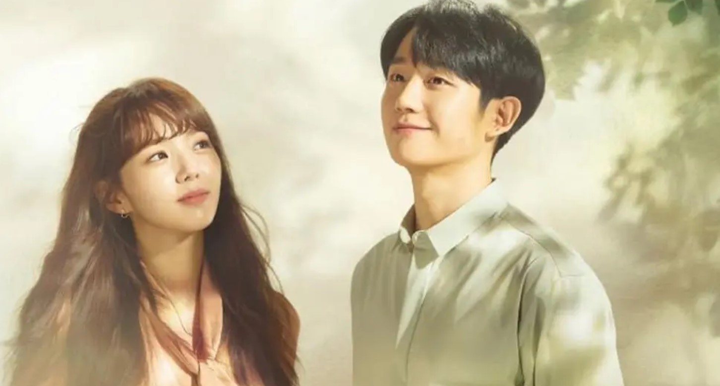 Romantic scene from the Korean drama A Piece of Your Mind (2020), featuring the main couple sharing a moment under soft lighting. The woman gazes up at the man, who smiles warmly back at her. This heartwarming series explores the quiet journey of love, healing, and emotional connection.