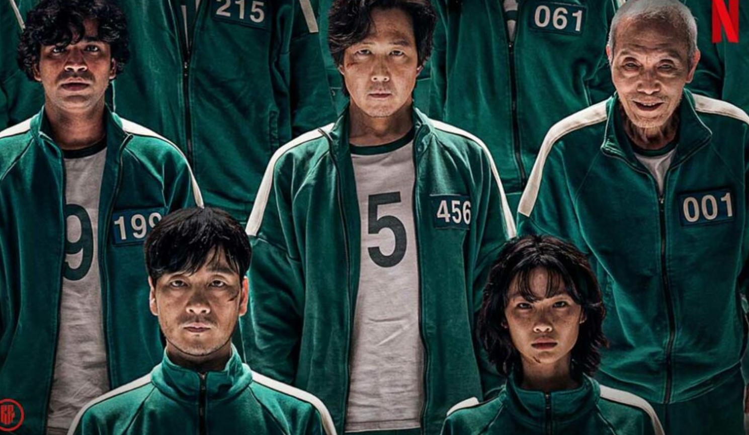 Main characters from Squid Game Season 1 in green tracksuits with their assigned numbers, including 456, 190, and 001, stand in a tense lineup. Their serious expressions convey the intense and high-stakes atmosphere of the series, as they prepare for the dangerous and life-threatening games. Perfect for a Squid Game season 1 full review.