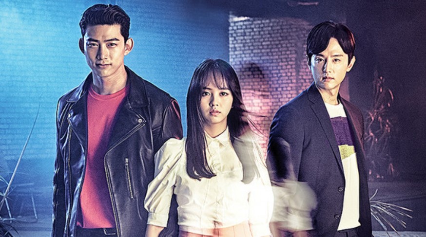 Poster for the Korean drama Let’s Fight the Ghost, showing the three main characters. The male character on the left stands confidently in a leather jacket, while the female character in the center exudes an ethereal presence with a ghostly blur effect, and the male character on the right stands with a serious expression. The backdrop features dark tones, enhancing the mystery of the scene. Let’s Fight the Ghost full review