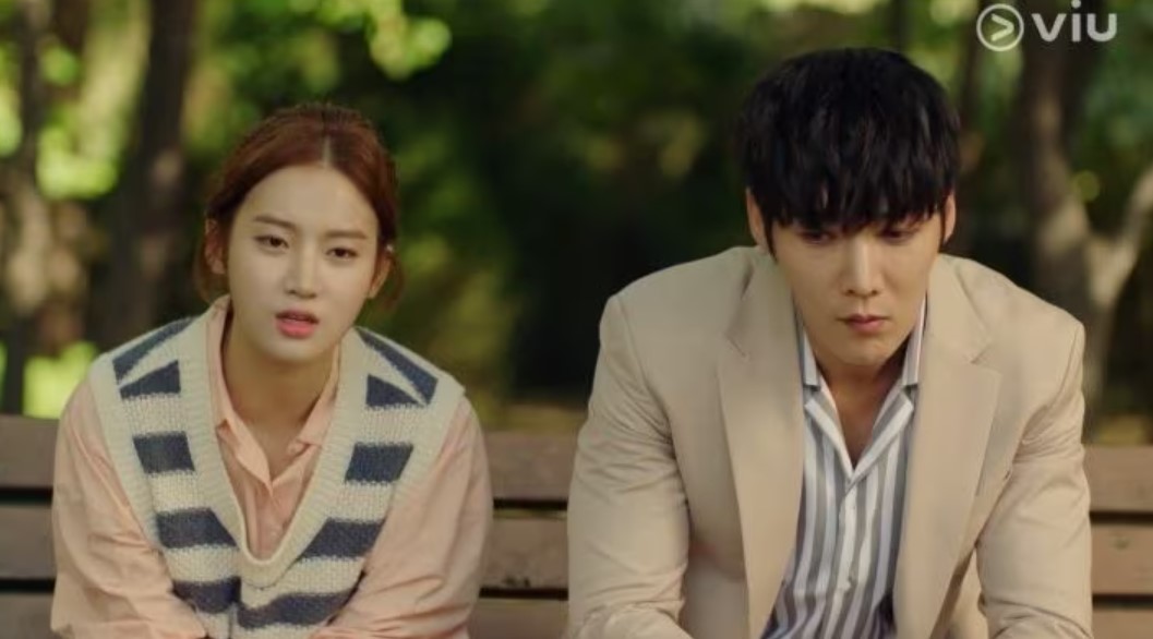 Zombie Detective K-Drama scene with the lead characters sitting on a park bench, deep in thought.