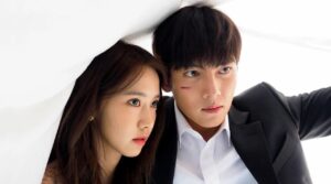 Kim Je Ha (Ji Chang Wook) and Go An Na (Im Yoon Ah) share an intense moment under a sheet, as tension builds in this iconic scene from The K2, showcasing their bond amidst danger.