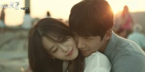 Kim Je Ha (Ji Chang Wook) embraces Go An Na (Im Yoon Ah) in a romantic beachside moment from The K2, capturing the warmth and connection between the characters.