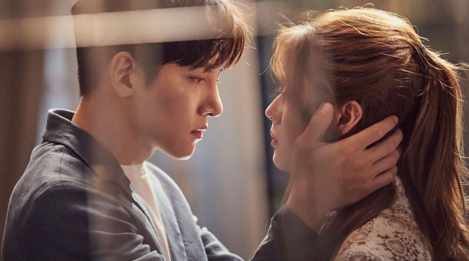A romantic scene of a couple gazing into each other's eyes, with the man gently holding the woman's face, captured through a glass window, creating an intimate moment. 