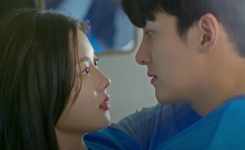 Ji Chang-Wook and Kim You-Jung sharing an intense, romantic moment in 'Backstreet Rookie,' as their characters, Choi Dae-Hyun and Jung Saet-Byul, gaze into each other's eyes. This emotional close-up captures the chemistry and growing affection between the leads in a pivotal scene.