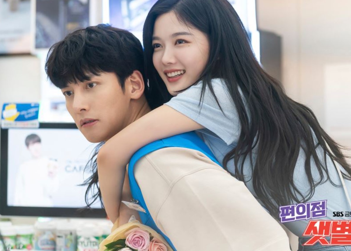 "Ji Chang-Wook and Kim You-Jung in a sweet, playful moment from 'Backstreet Rookie.' Kim You-Jung is playfully giving Ji Chang-Wook a piggyback ride while smiling, showing their strong chemistry in this romantic and lighthearted scene from the K-drama series.