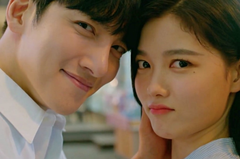 "Ji Chang-Wook and Kim You-Jung in a close-up moment from 'Backstreet Rookie,' showcasing their adorable chemistry. The couple shares a playful and affectionate expression, emphasizing the lighthearted and romantic nature of the K-drama.