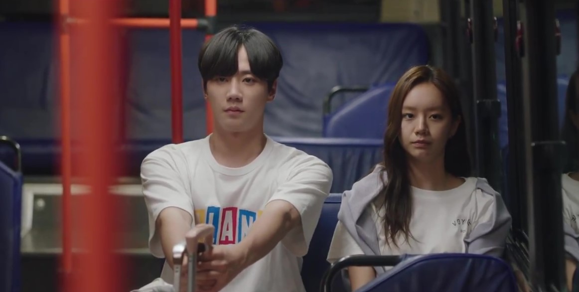 Scene from Korean drama 'The Forbidden Marriage' showing the lead characters sitting silently on a bus at night, reflecting a tense and emotional moment