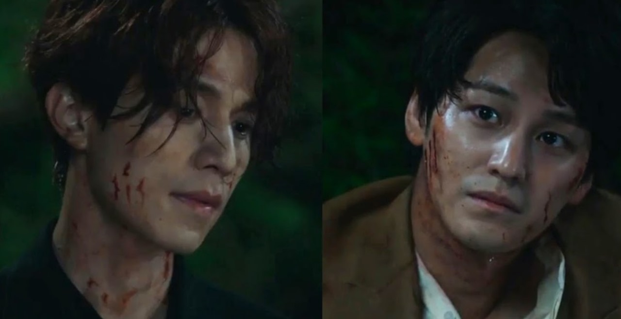 Intense moment from 'Tale of the Nine-Tailed,' showing Lee Dong-wook and Kim Bum covered in blood, portraying a dramatic and emotional confrontation.