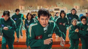 Squid Game Season 2 full review - action-packed moment showing contestants in green tracksuits running during the high-stakes game, with the protagonist at the forefront.