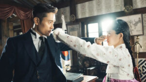 Scene from the popular drama 'Mr. Sunshine,' featuring an intense moment between two characters in traditional Korean attire, highlighting the popular drama genre.
