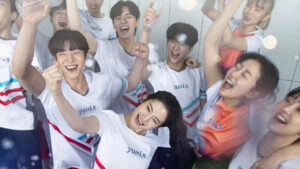 Love All Play Full Review: A group of young athletes celebrating a victory in a badminton team, smiling and cheering together, highlighting the blend of passion and teamwork in the K-drama.