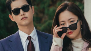 Vincenzo full review: A stylish and intense moment from the drama series featuring Vincenzo Cassano and Hong Cha-young, both wearing sunglasses, exuding confidence and intrigue.