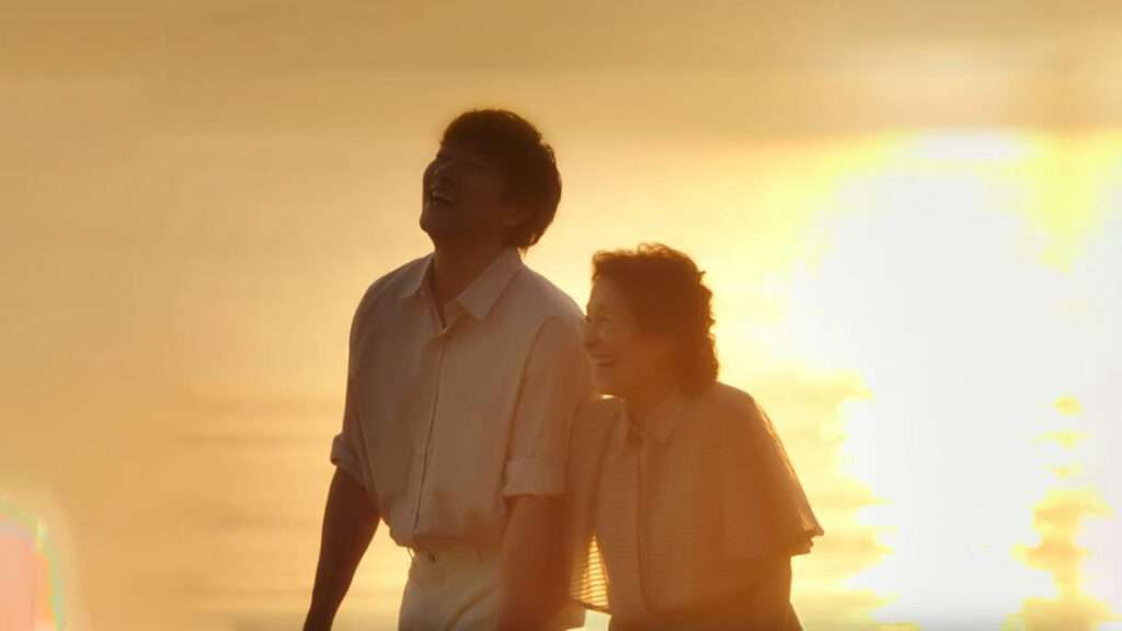 Scene from the KDrama Heavenly Ever After, featuring a joyful couple walking hand-in-hand during sunset, highlighting the emotional connection and beauty of the moment. Top 2025 KDrama Songs