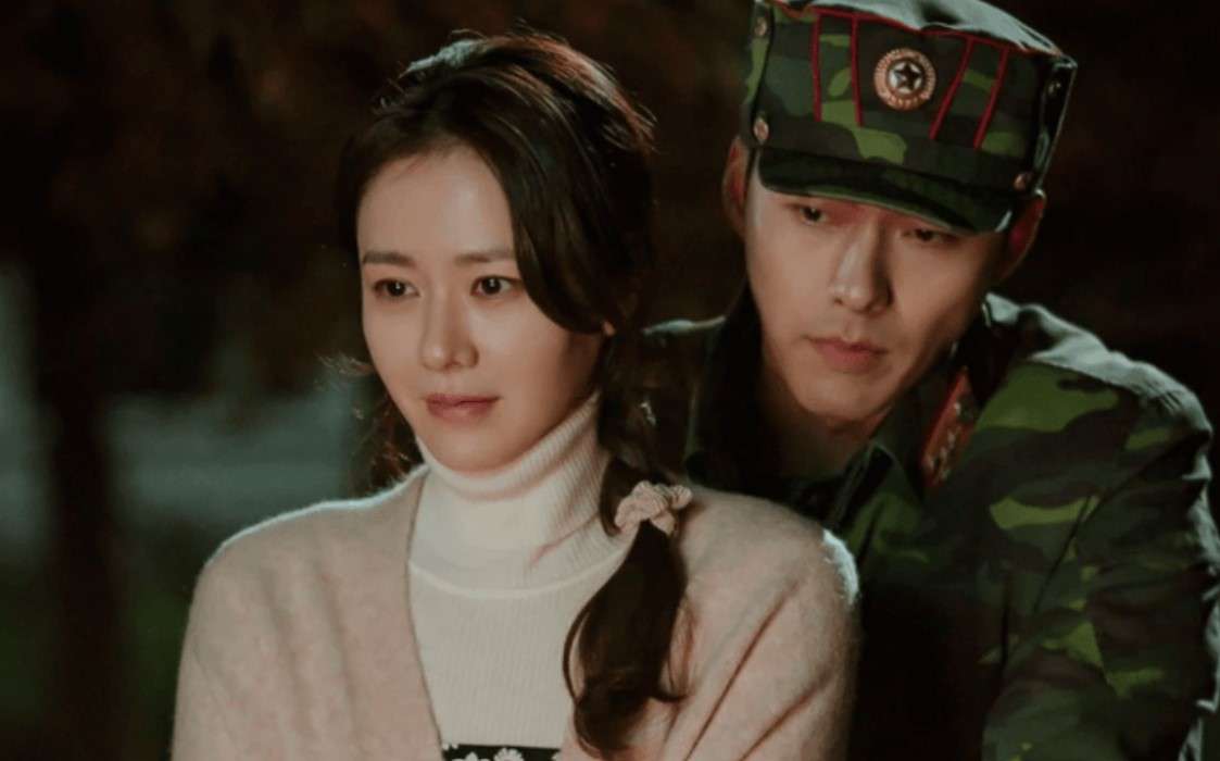 A woman and man in military uniforms from "Crash Landing on You," featured in Most-Streamed KDrama Soundtracks. 
