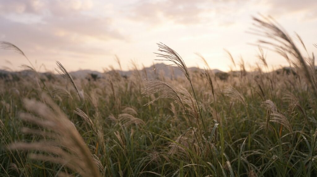 Wild grass swaying in the wind symbolizing resilience in Korean poetry