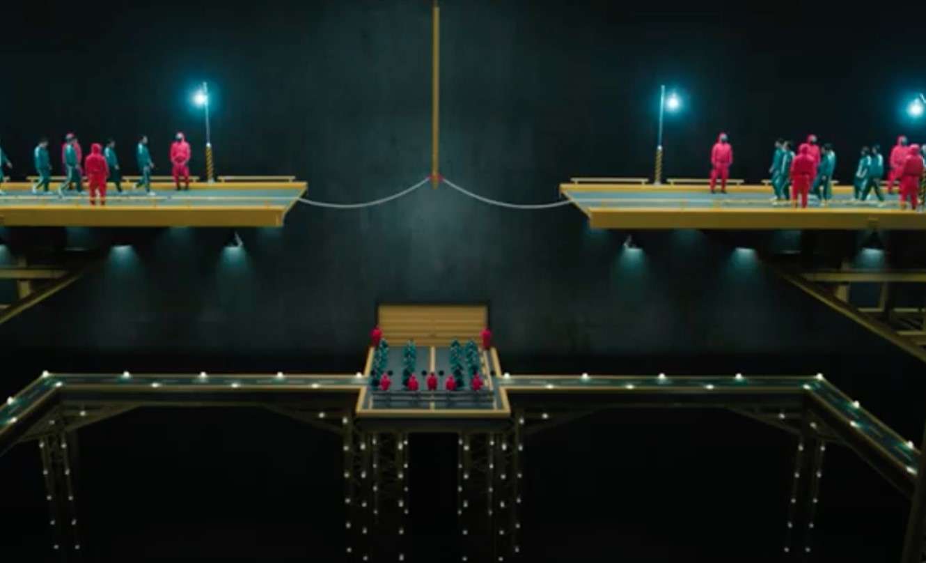 Individuals gather on a bridge, embodying the suspenseful atmosphere of Squid Game Season 3 in this striking image.