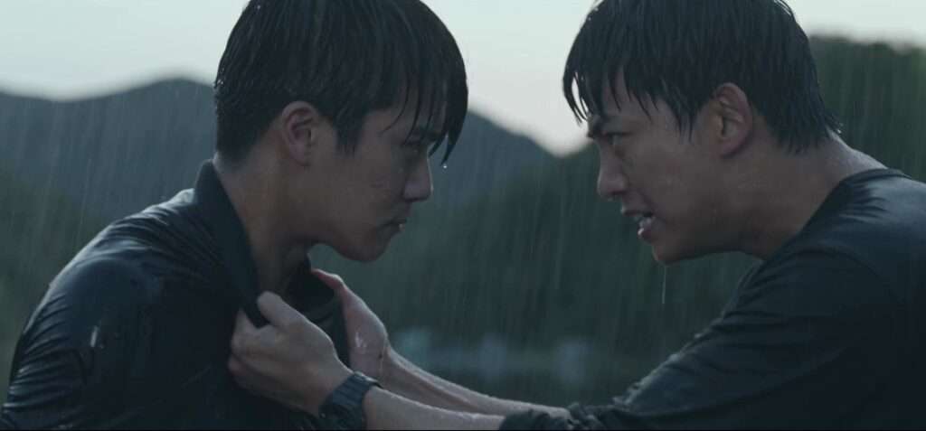 Intense scene from the Blind full review showing two characters in a dramatic confrontation under heavy rain, emphasizing the emotional and suspenseful tone of the Korean drama.