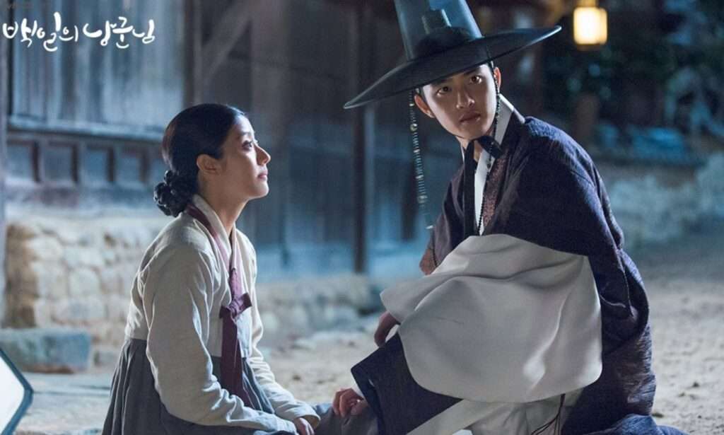 Night scene from Korean drama 100 Days My Prince showing the Crown Prince and female lead in traditional attire sharing an emotional moment under soft lantern light – 100 Days My Prince full review