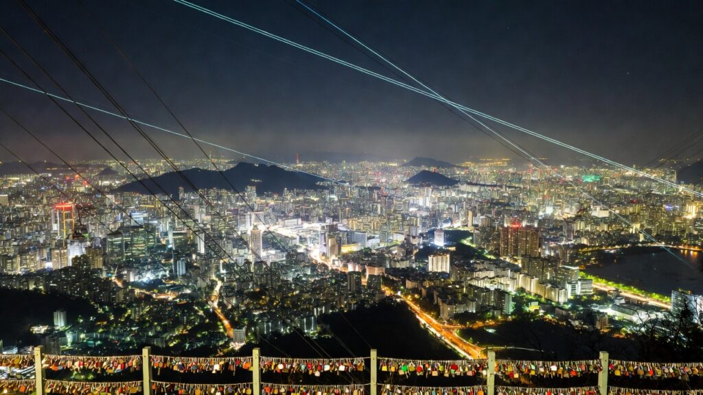 Romantic night panoramic view from N Seoul Tower overlooking Seoul skyline.