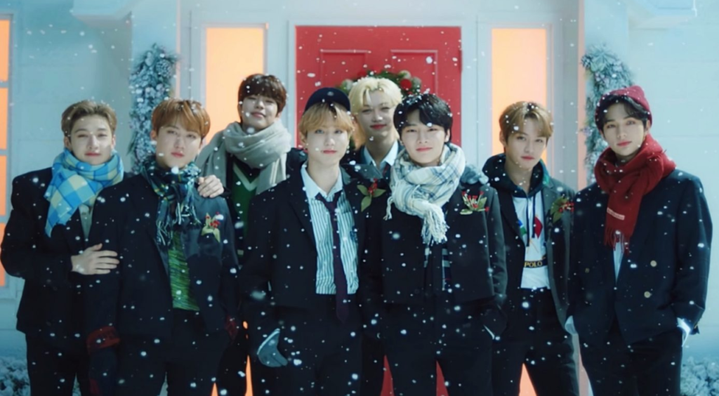 Stray Kids memebers in a snowy night
