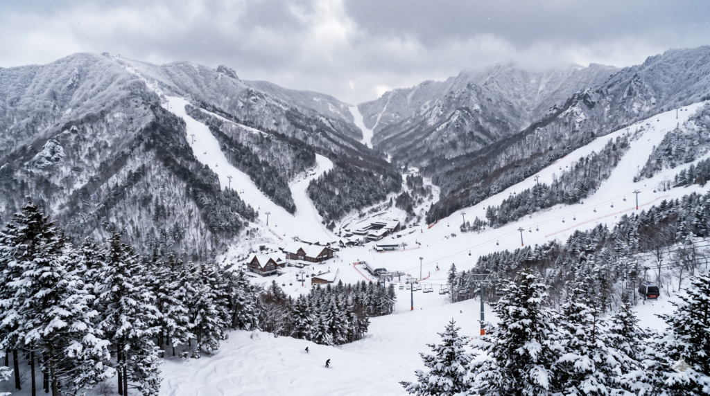 Long winding ski slopes of High1 Resort descending through snow-covered mountains in Jeongseon Korea